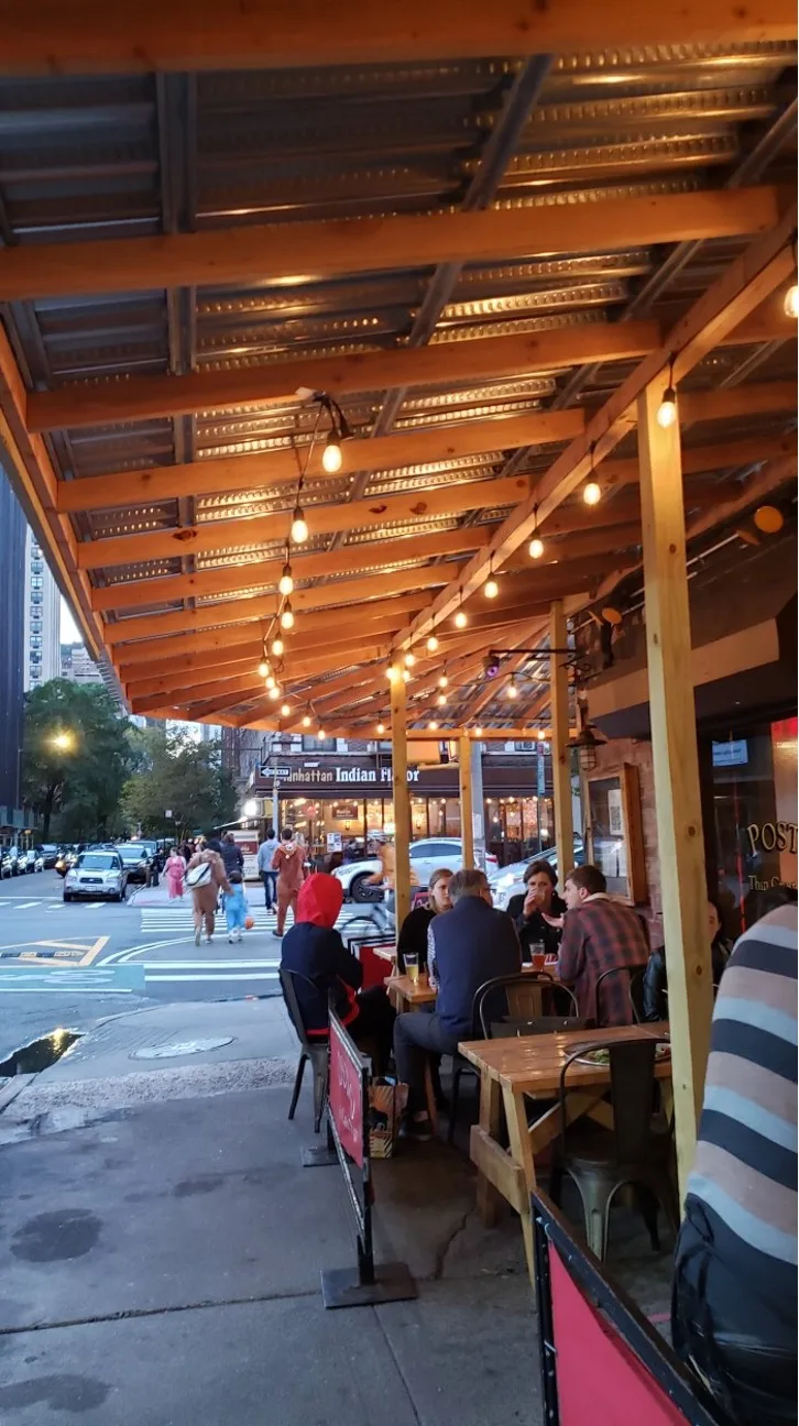 Outdoor seating at Posto. Photo by Sora Vernkoff
