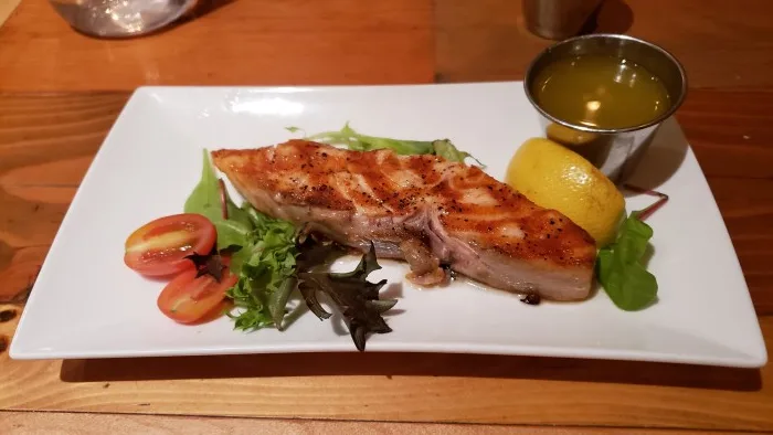 A salmon add-on to the avocado and tomato salad at Lokal Mediterranean Kitchen. Photo by Sora Vernikoff