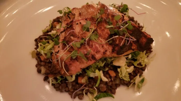 Salmon on lentils with shaved raw Brussels sprouts cooked in lemon vinaigrette. Photo by Sora Vernikoff