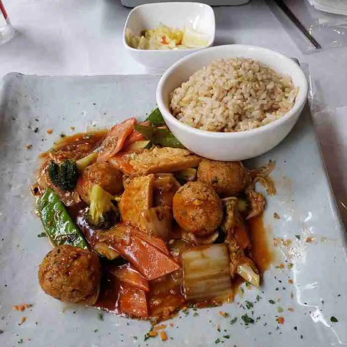 Spicy Vegan “Meat Balls” and Soy “Chicken” in Garlic Sauce with a variety of vegetables at Franchia Vegan Café. Photo by Sora Vernikoff