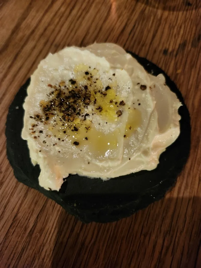 Whipped butter, olive oil and spices for the hot, fresh pretzelized bread at Amali Mediterranean Restaurant. Photo by Sora Vernikoff.