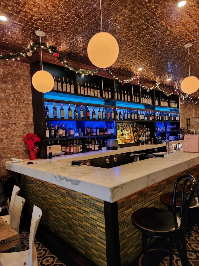 Bar seating at Bocca di Bacco Italian Restaurant in Manhattan's Hell's Kitchen. Photo by Sora Vernikoff