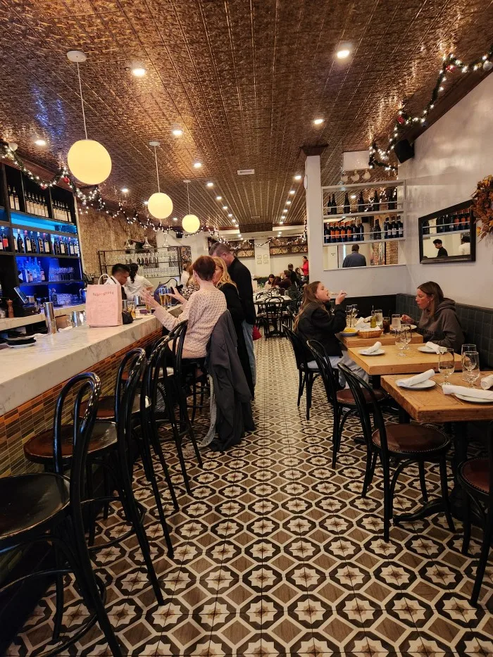 Comfortable atmosphere at Bocca di Bacco Italian Restaurant in Manhattan's Hell's Kitchen. Photo by Sora Vernikoff