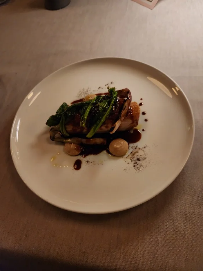 Green Circle Chicken Breast with Focaccia purée, Charcoaled Spring Onion, and Choi Rab. Photo by Sora Vernikoff