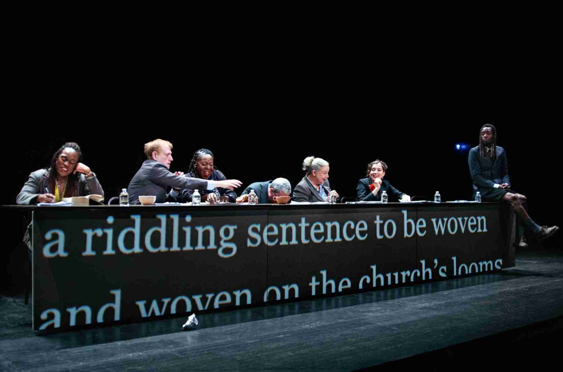 L-R: Stephanie Weeks, Scott Shepherd, Dee Beasnael, Vin Knight, Kate Benson, Maggie Hoffman, Christopher Rashee Stevenson In a Scene from Elevator Repair Service Ulysses. Photo by Owen Hope