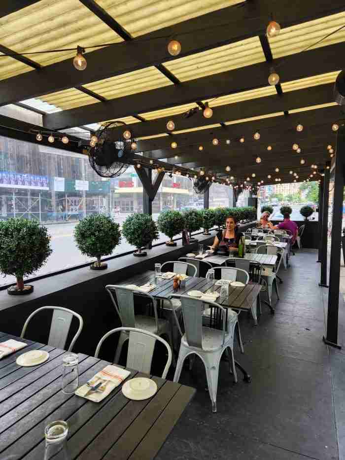 A view of outdoor seating at The Smith Restaurant in New York's East Village. Photo by Sora Vernikoff