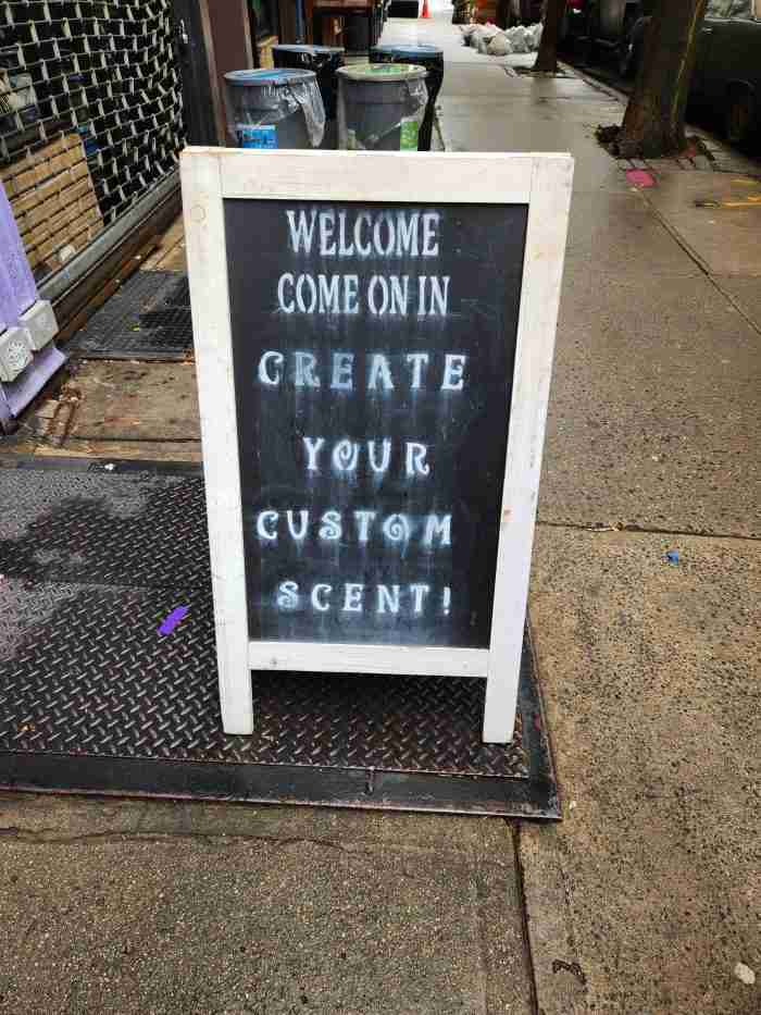 A sidewalk sign at the Fragrance Shop New York in New York's East Village. Photo by Sora Vernikoff