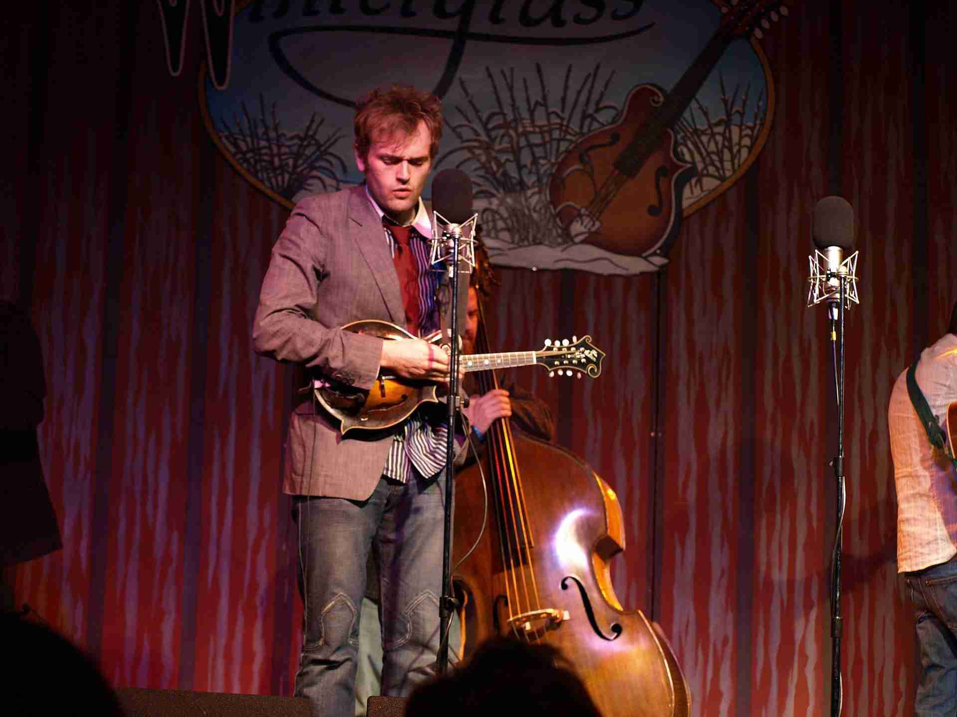 Chris Thile and Punch Brothers at Wintergrass, Bellevue, Washington, March 11, 2008. By Eric Frommer, CC BY-SA 2.0 <https://creativecommons.org/licenses/by-sa/2.0>, via Wikimedia Commons