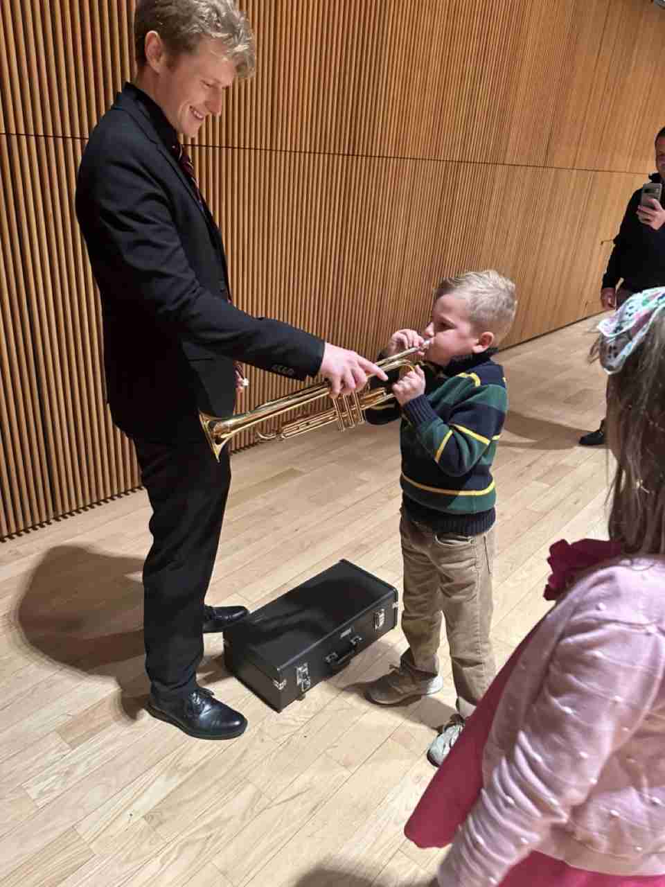 A child trying out a trumpet. Photo courtesy PACS