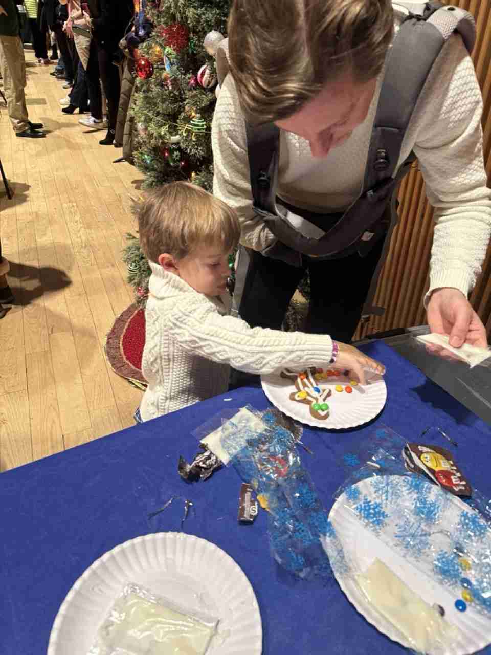 Children decorating their cookies. Courtesy PACS