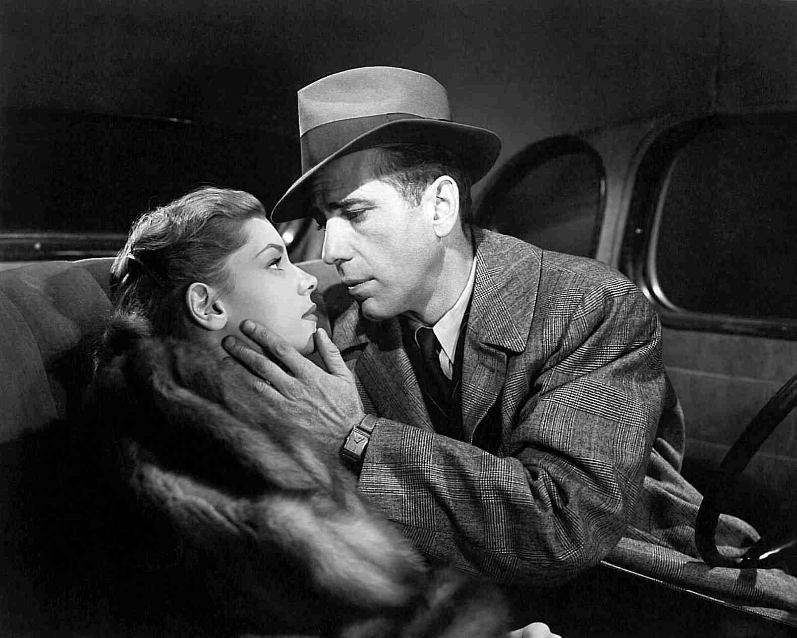 Lauren Bacall & Humphrey Bogart The Big Sleep Publicity Photo. Warner Bros., Public domain, via Wikimedia Commons