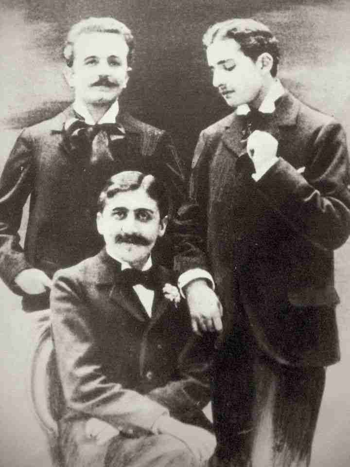 Marcel Proust (seated), Robert de Flers (left) and Lucien Daudet (right), ca. 1894. Public Domain