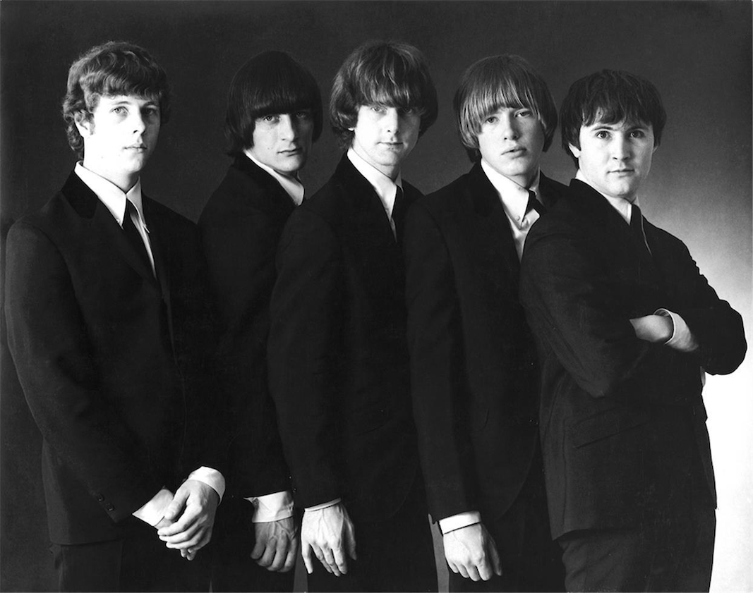 The Byrds in early 1965. L-R Chris Hillman (bass), Gene Clark (vocals, tambourine, guitar), Roger McGuinn (12-string guitar, vocals), Michael Clarke (drums) and David Crosby (rhythm guitar, vocals). KRLA Beat/Beat Publications, Inc., Public domain, via Wikimedia Commons