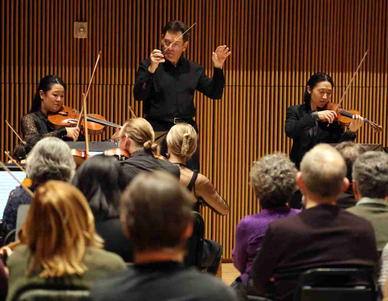 Conductor David Bernard with Soloists Sean Lee, Violin, and Katharina Kang Litton, Viola performing Mozart's Sinfonia Concertante in E-flat major, K. 364 in the Park Avenue Chamber Symphony's "Immersive Mozart" concert experience at the DiMenna Center for Classical Music in New York City. Courtesy Park Avenue Chamber Symphony.
