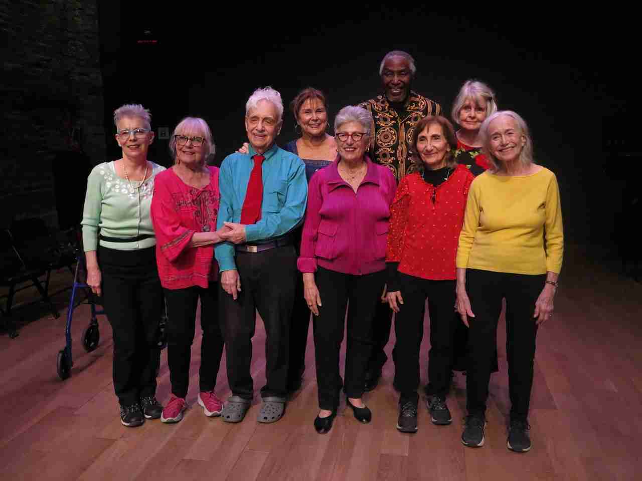 L-R: Ilana Abramovitch, Susan Binet, Jonathan Ned Katz, Christine Koenig, Nora Galer, Harold Thomas, Joanne Riel, Sally Plass and Lorraine Marx-SInger in "Above Ground - Not Exactly a Comedy," a stage work in which ten senior actors reflect on how they deal with the undeniable fact of getting old, regaling the audience with improvised personal experiences of maturity mixed with childhood memories. Directed by Nancy Gabor and Paul Binnerts, presented by La MaMa E.T.C. March 13 to 23, 2025. Photo by Jonathan Slaff.