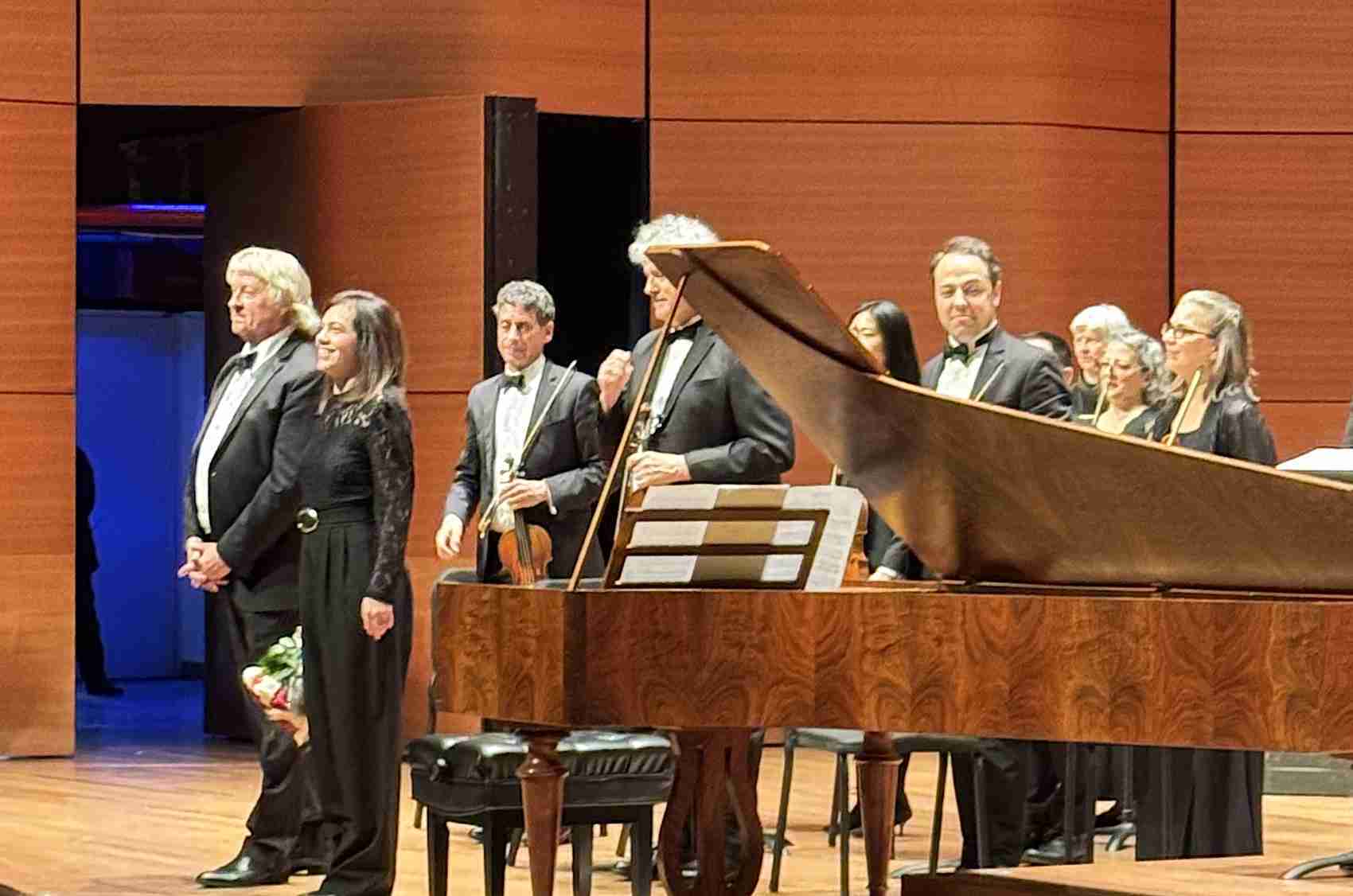 Maestro Thomas Crawford and Petra Somlai, fortepiano taking bows during extended applause with the American Classical Orchestra in Lincoln Center's Alice Tully Hall in New York City. Photo by Edward Kliszus
