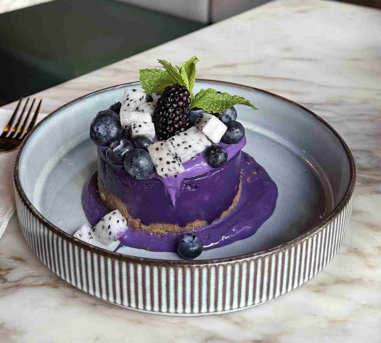 Ube Cheesecake with fruit and mint at Ginger and Lemongrass Vietnamese Fusion Restaurant. Photo by Valerie Blanchard