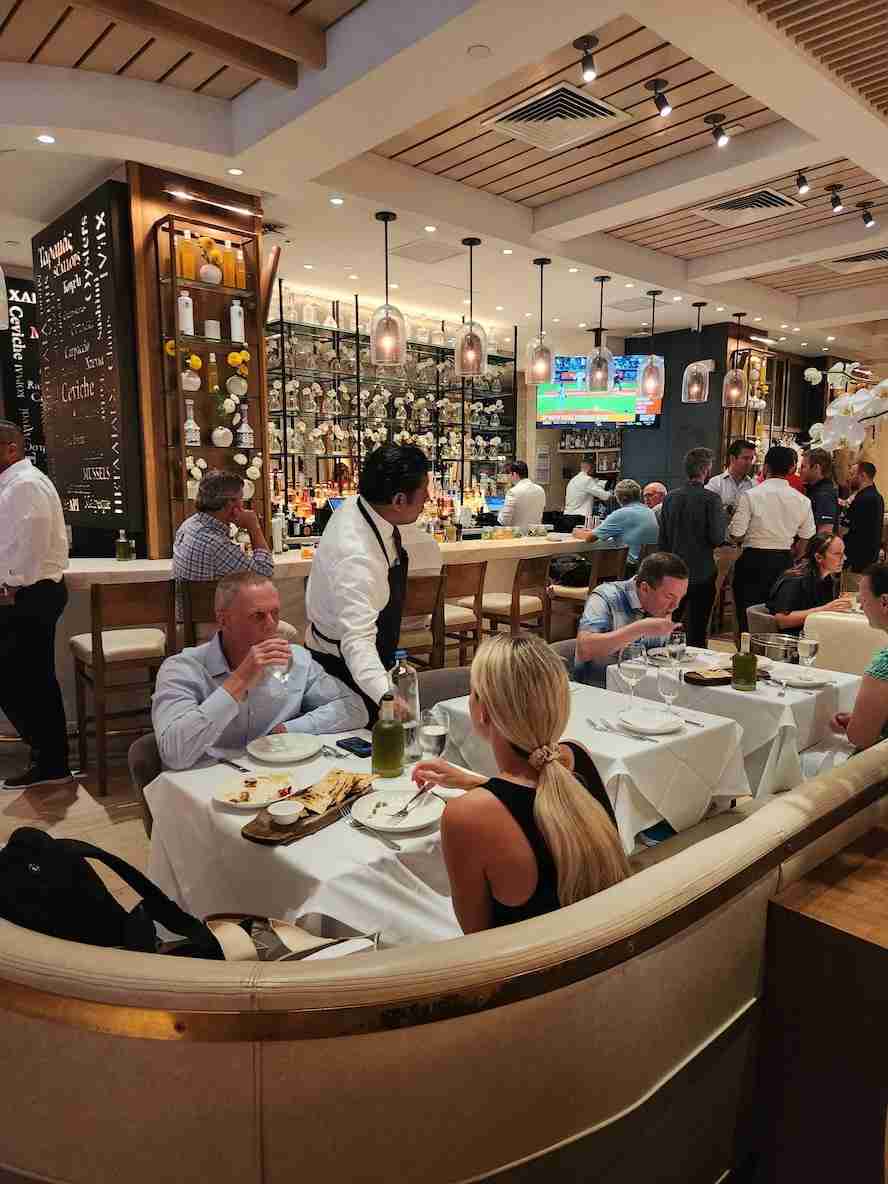 Bar seating and dining at Avra Madison. Photo by Sora Vernikoff