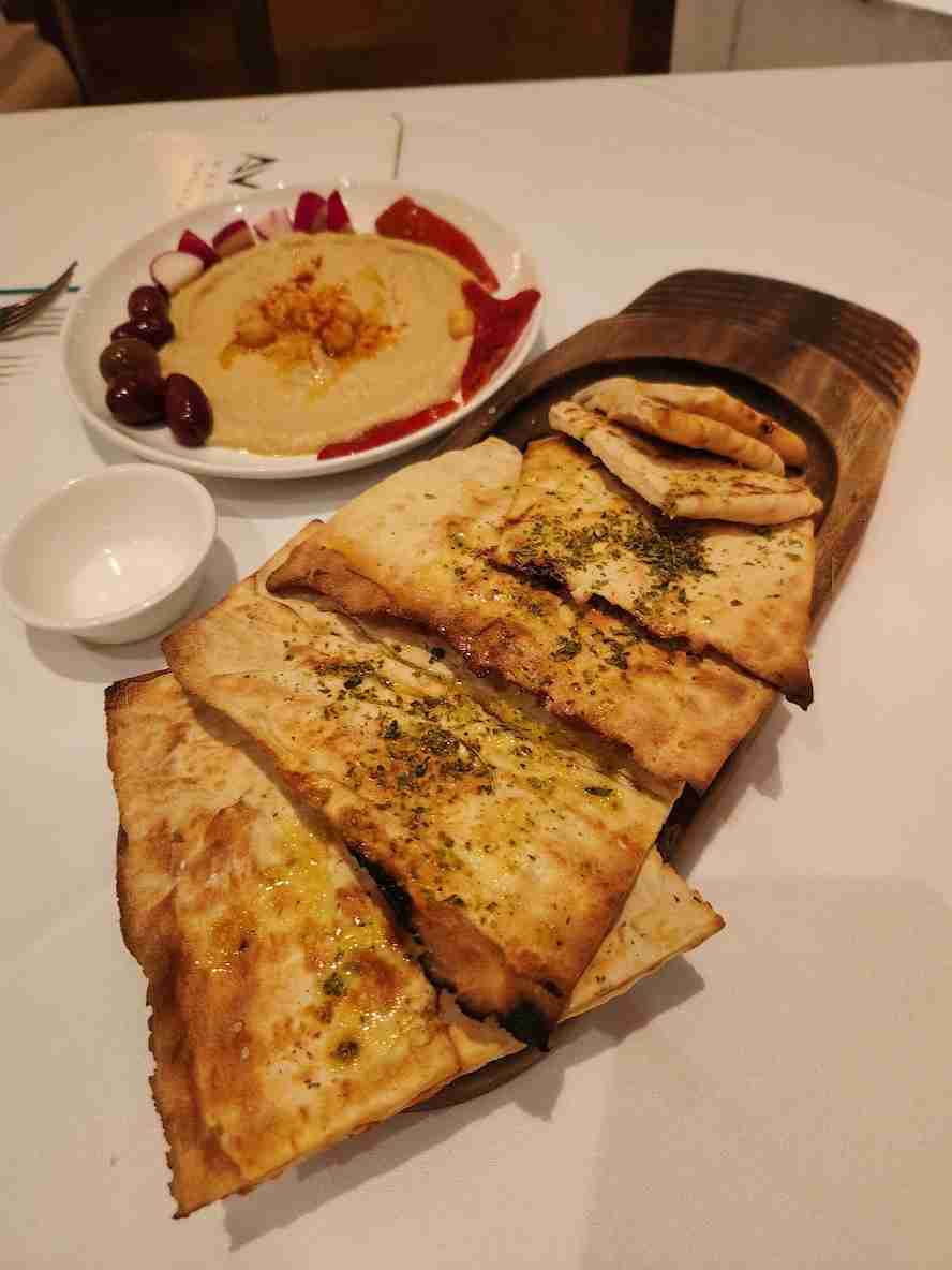 Delicious Pita Bread and Hummus at Avra Madison. Photo by Sora Vernikoff