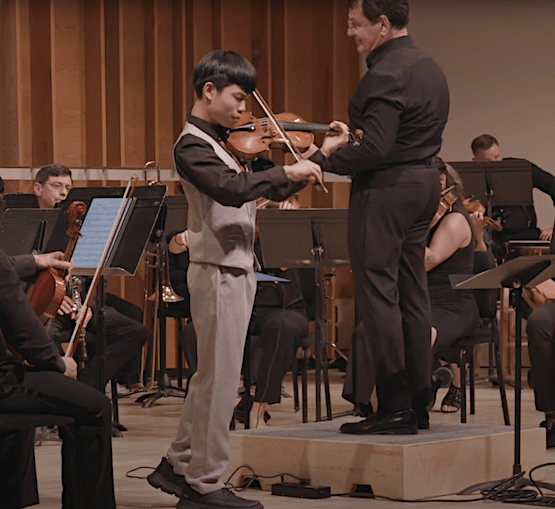 Jacky Chuang, Violin, performing with the Park Avenue Chamber Symphony, conducted by David Bernard, in the Kaufman Music Center’s 2025 Special Music High School Concerto Competition Winners' Concert at Merkin Concert Hall, New York City. Screen capture courtesy KaufmanMusicCenter.org.