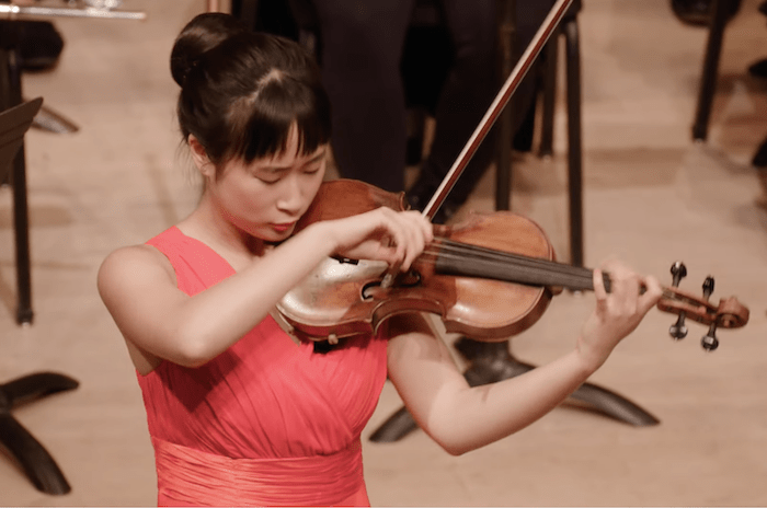 Nickita Zhang, Violin, performing with the Park Avenue Chamber Symphony, conducted by David Bernard, in the Kaufman Music Center’s 2025 Special Music High School Concerto Competition Winners' Concert at Merkin Concert Hall, New York City. Screen Capture courtesy KaufmanMusicCenter.org