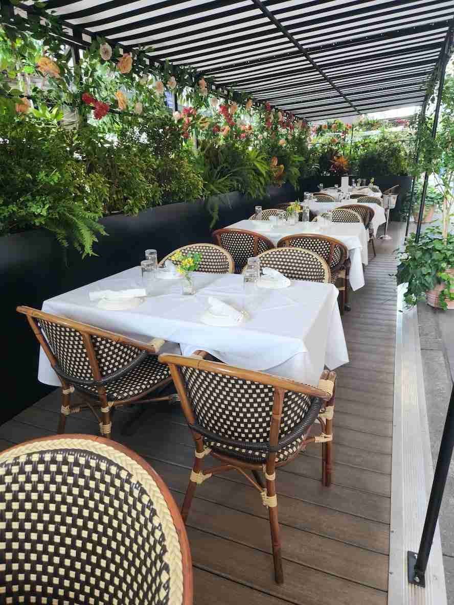 Outdoor Seating at Avra Madison. Photo by Sora Vernikoff