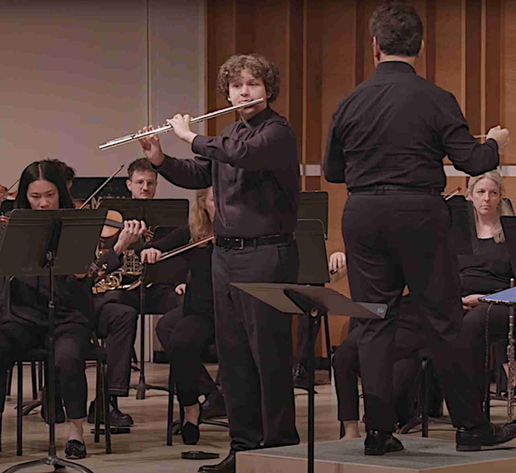 Tommy Wazelle, Flute, Performing with the Park Avenue Chamber Symphony, conducted by David Bernard, in the Kaufman Music Center’s 2025 Special Music High School Concerto Competition Winners' Concert at Merkin Concert Hall, New York City. Screen capture courtesy KaufmanMusicCenter.org