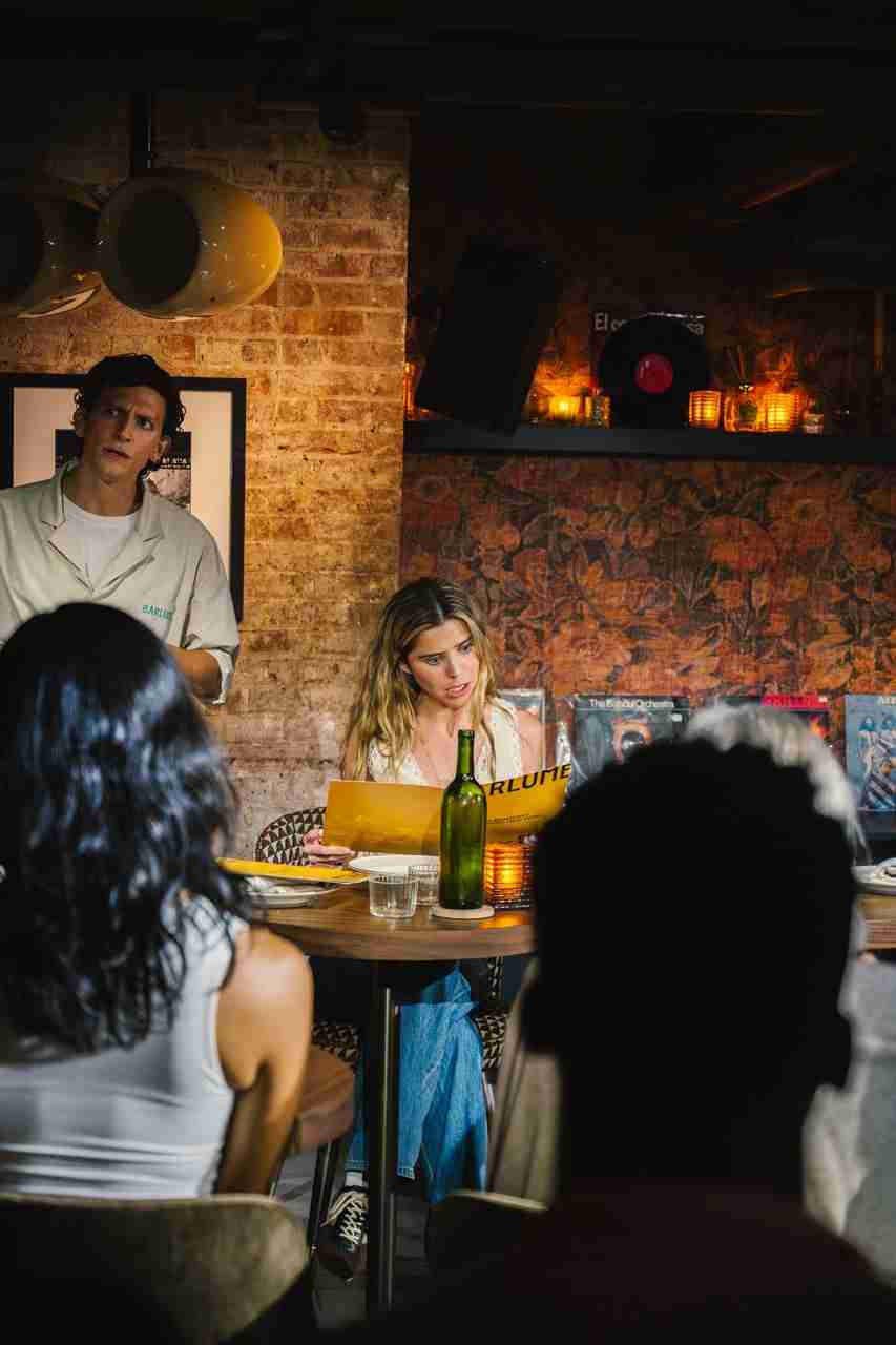 Mateo d’Amato and Amelia Gwaltney in a scene from "Fine Dining" in Pop Up Dinner Theater @VBarlume Downstairs. Photo by Delia Dumont