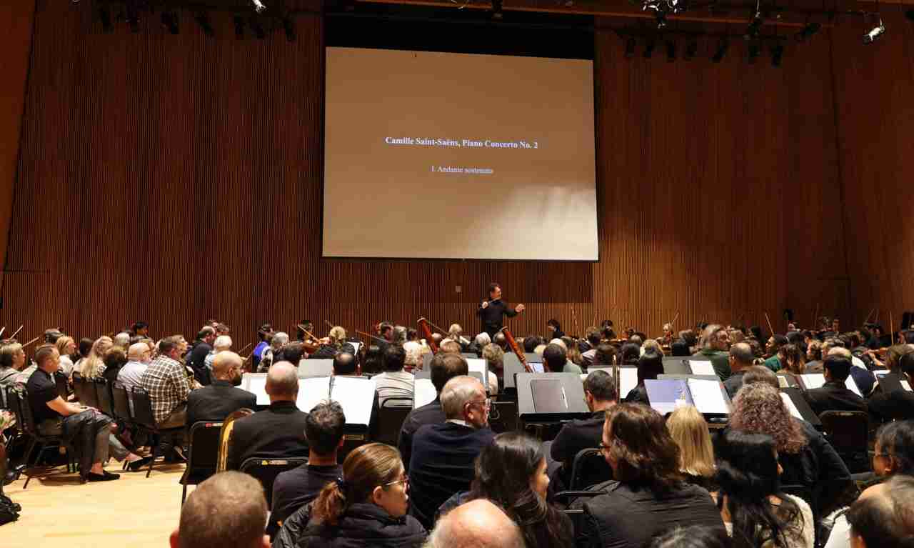 Maestro David Bernard describes the music with the Park Avenue Chamber Symphony as they present Scintillating Saint-Saëns at the DiMenna Center for Classical Music in NYC. Photo by Adam Bundy Photography