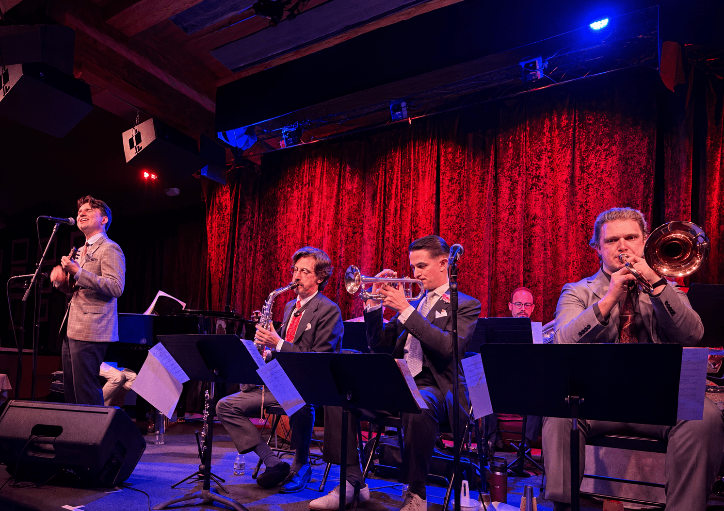 L-R: Bryce Edwards, Vocals and Ukulele, Ricky Alexander, Alto Saxophone and Clarinet, Mike Davis, Cornet, Jay Rattman, Bass Saxophone, and Josh Holcomb, Trombone, at Birdland Jazz Club, in Hot Combination: The Cliff Edwards/Red Nichols Project NYC. Photo by Edward Kliszus